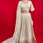 OFF WHITE COLOUR BANARASI LEHENGA WITH READYMADE BLOUSE & CHINON DUPATTA EMBELLISHED WITH SEQUINS WORK