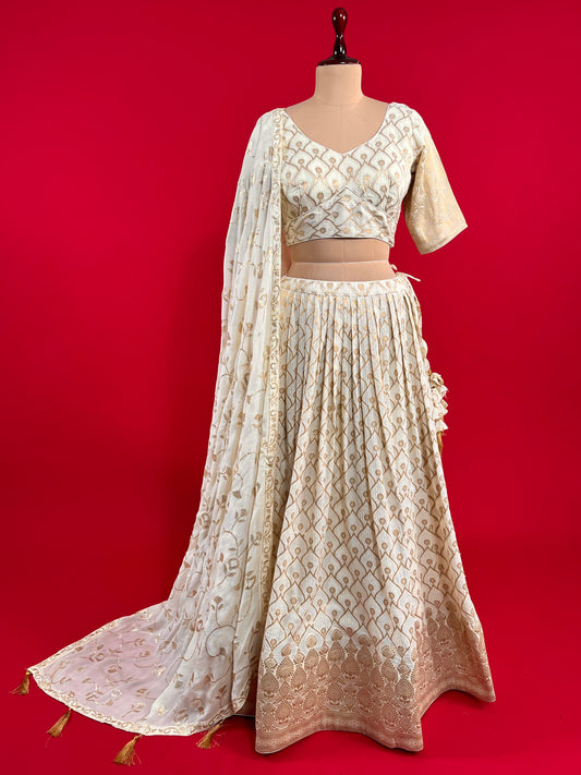 OFF WHITE COLOUR GEORGETTE BANARASI LEHENGA WITH READYMADE BLOUSE & CHINON EMBROIDERED DUPATTA EMBELLISHED WITH SEQUINS WORK