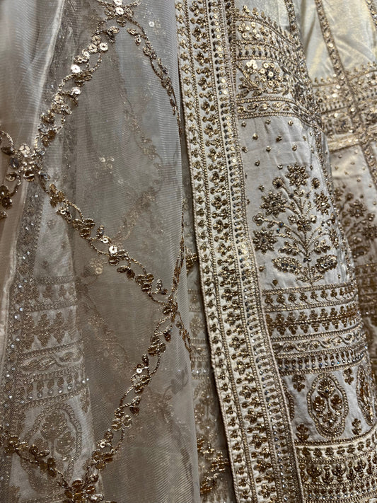 GOLDEN COLOUR SILK TISSUE EMBROIDERED LEHENGA EMBELLISHED WITH METAL SEQUENCE WORK