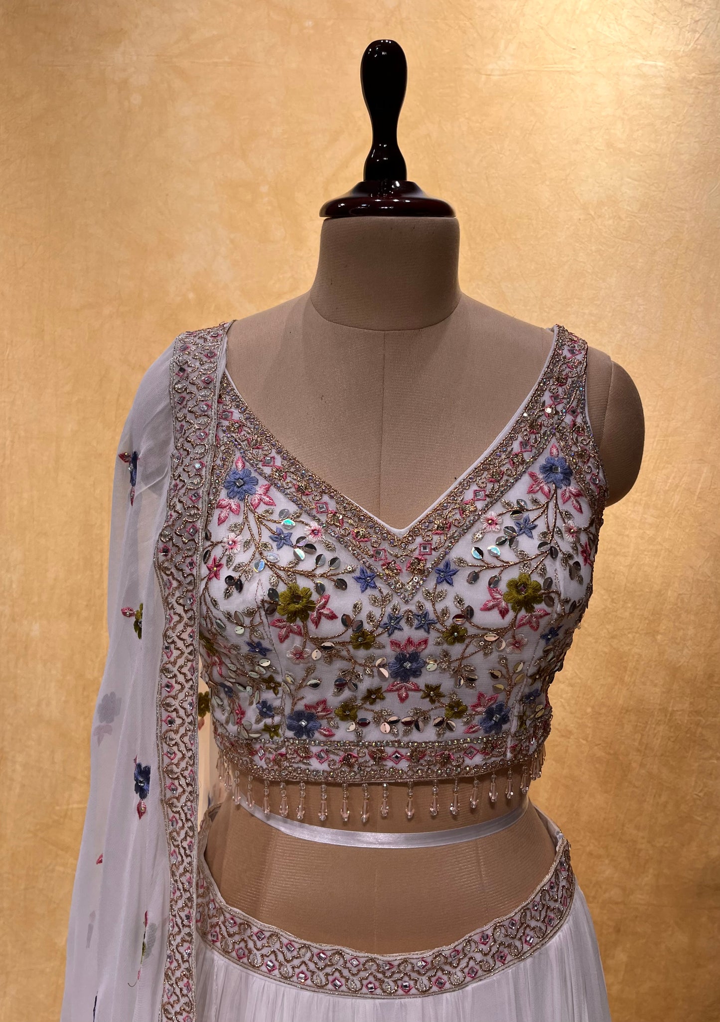 WHITE COLOUR GEORGETTE LEHENGA WITH CROP TOP BLOUSE EMBELLISHED WITH THREAD, SEQUINS & BEADS WORK