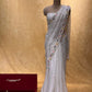 WHITE COLOUR ORGANZA HAND EMBROIDERED SAREE EMBELLISHED WITH SEQUINS, CUTDANA & PEARL WORK