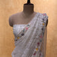 WHITE COLOUR ORGANZA HAND EMBROIDERED SAREE EMBELLISHED WITH SEQUINS, CUTDANA & PEARL WORK