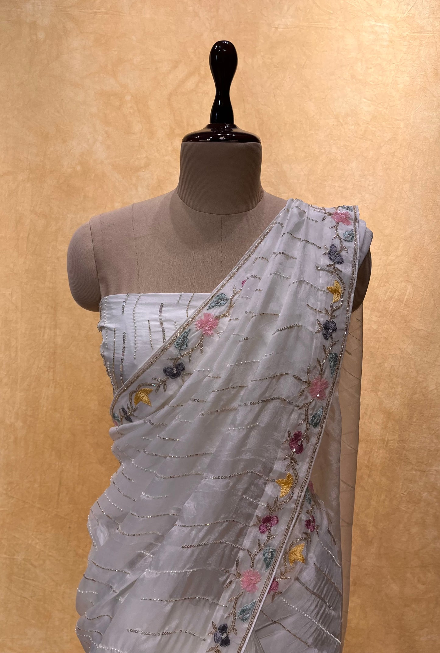 WHITE COLOUR ORGANZA HAND EMBROIDERED SAREE EMBELLISHED WITH SEQUINS, CUTDANA & PEARL WORK