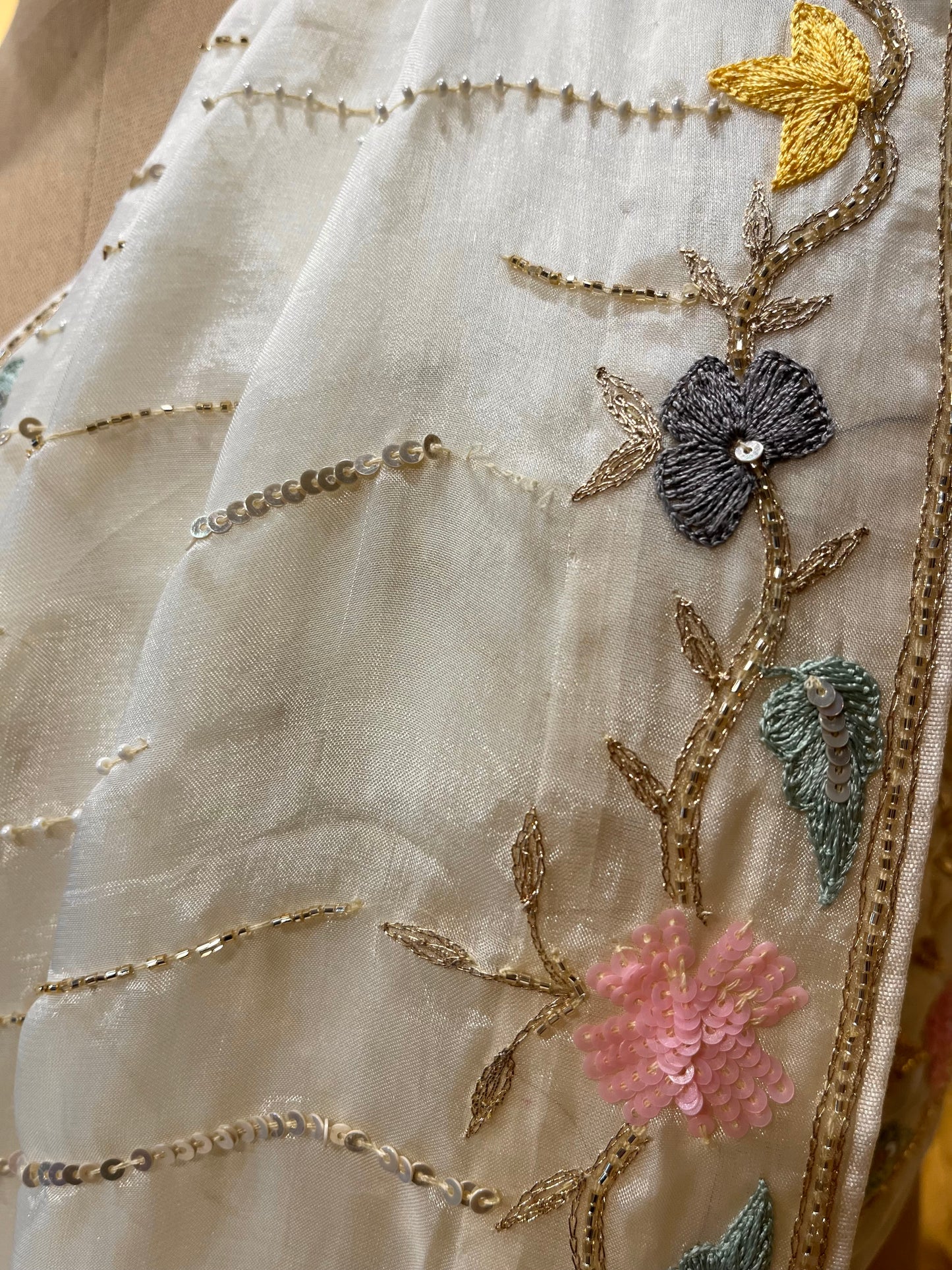 WHITE COLOUR ORGANZA HAND EMBROIDERED SAREE EMBELLISHED WITH SEQUINS, CUTDANA & PEARL WORK