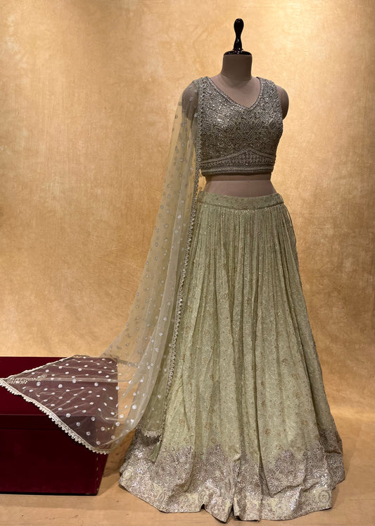 PISTA COLOUR GEORGETTE EMBROIDERED LEHENGA WITH CROP TOP BLOUSE & NET DUPATTA EMBELLISHED WITH MIRROR, PEARL & RESHAM WORK