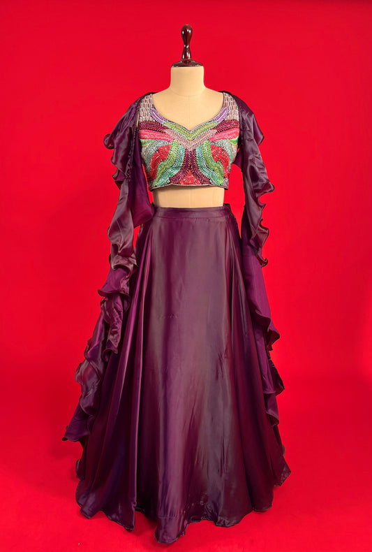 WINE COLOUR SATIN SKIRT WITH EMBROIDERED CROP TOP & RUFFLE DUPATTA EMBELLISHED WITH CUTDANA WORK