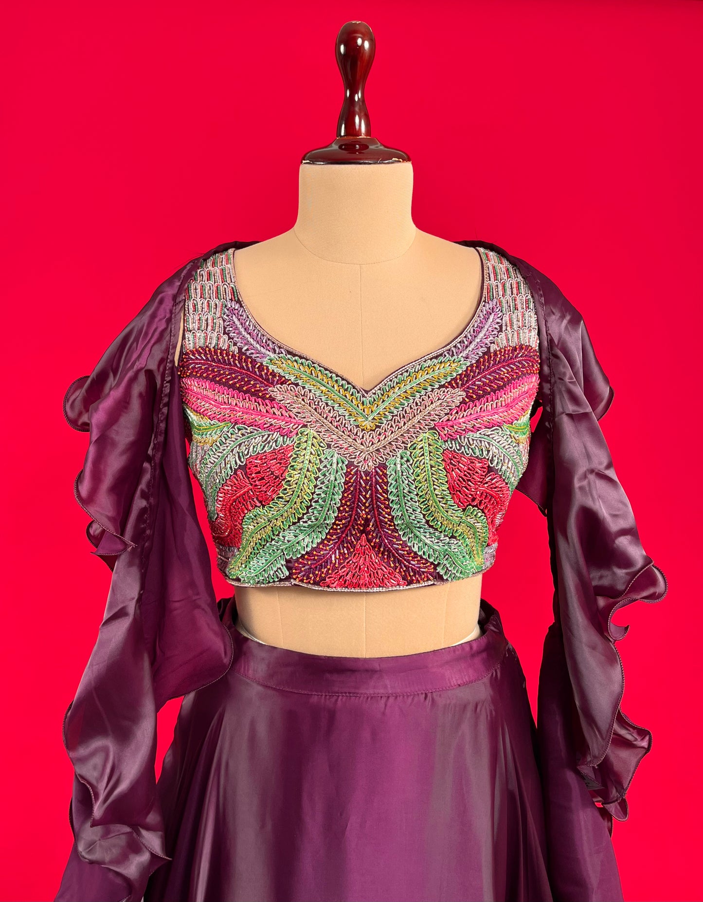 WINE COLOUR SATIN SKIRT WITH EMBROIDERED CROP TOP & RUFFLE DUPATTA EMBELLISHED WITH CUTDANA WORK