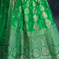 ( DELIVERY IN 25 DAYS ) GREEN COLOUR BANARASI SILK LEHENGA WITH UNSTITCHED BLOUSE EMBELLISHED WITH ZARI WEAVES