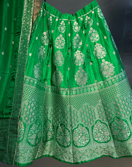( DELIVERY IN 25 DAYS ) GREEN COLOUR BANARASI SILK LEHENGA WITH UNSTITCHED BLOUSE EMBELLISHED WITH ZARI WEAVES