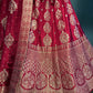 ( DELIVERY IN 25 DAYS ) MAROON COLOUR BANARASI SILK LEHENGA WITH UNSTITCHED BLOUSE EMBELLISHED WITH ZARI WEAVES