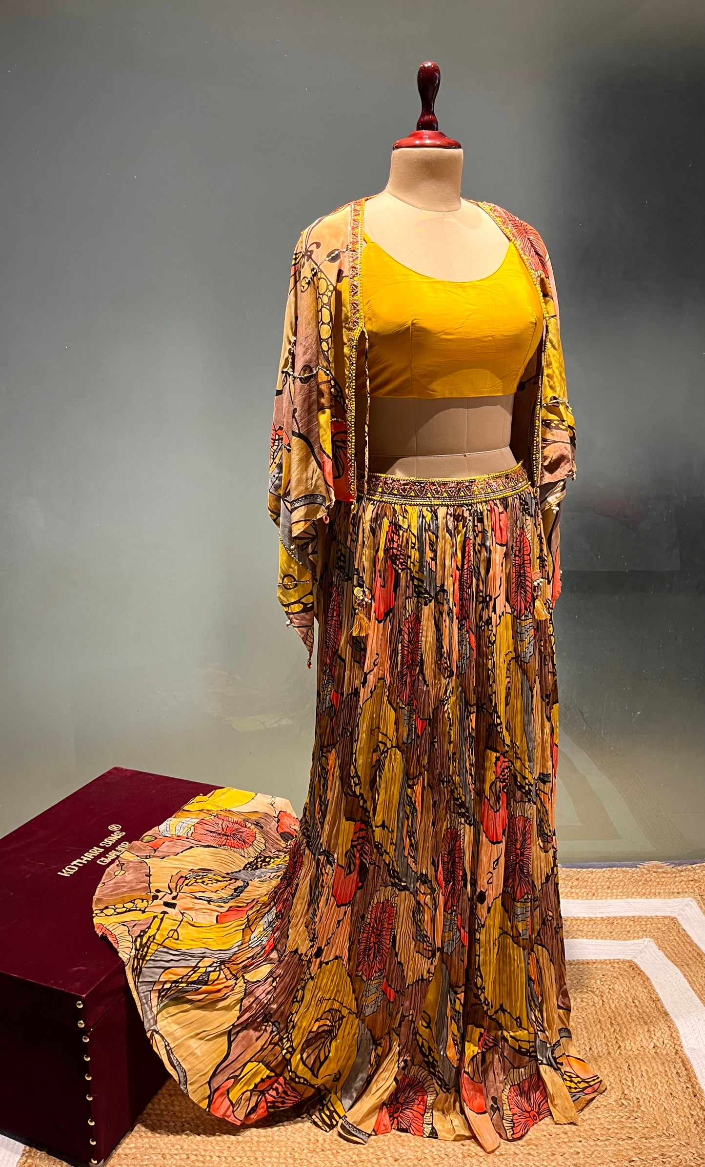 MUSTARD COLOUR CREPE SILK SKIRT WITH CROP TOP & JACKET EMBELLISHED WITH BEADS & MIRROR WORK