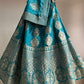 ( DELIVERY IN 25 DAYS ) TURQUOISE COLOUR BANARASI PURE SILK LEHENGA WITH UNSTITCHED BLOUSE EMBELLISHED WITH ZARIWEAVES