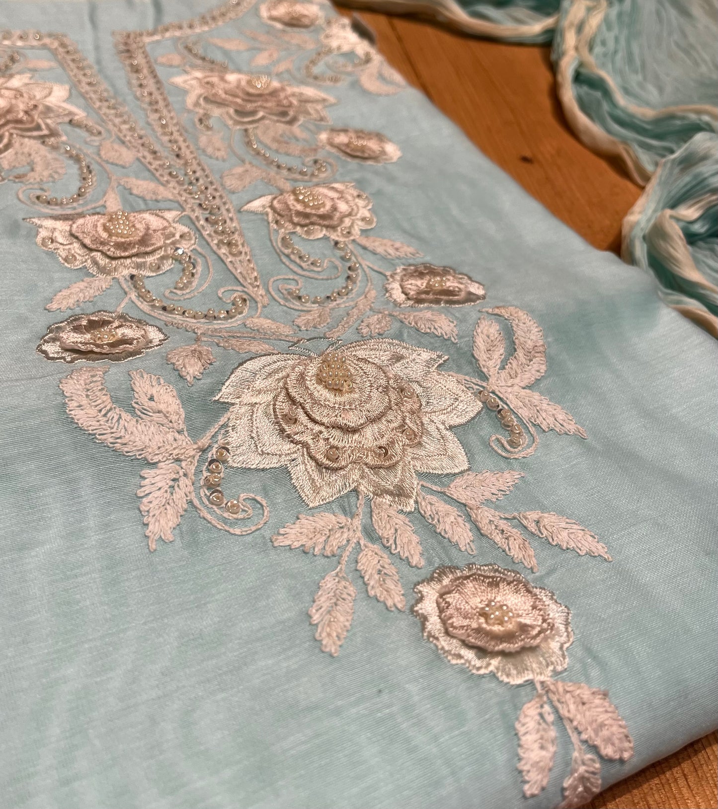 AQUA COLOUR CHANDERI UNSTITCHED SUIT WITH CHIFFON DUPATTA EMBELLISHED WITH RESHAM WORK