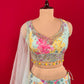 SEA BLUE COLOUR CREPE SILK LEHENGA WITH READYMADE CROP TOP & NET DUPATTA EMBELLISHED WITH SEQUINS & MIRROR WORK