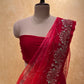 ( DELIVERY IN 20-25 DAYS ) RED SHADED PURE CHIFFON HAND EMBROIDERED SAREE EMBELLISHED WITH AARI & CUTDANA WORK