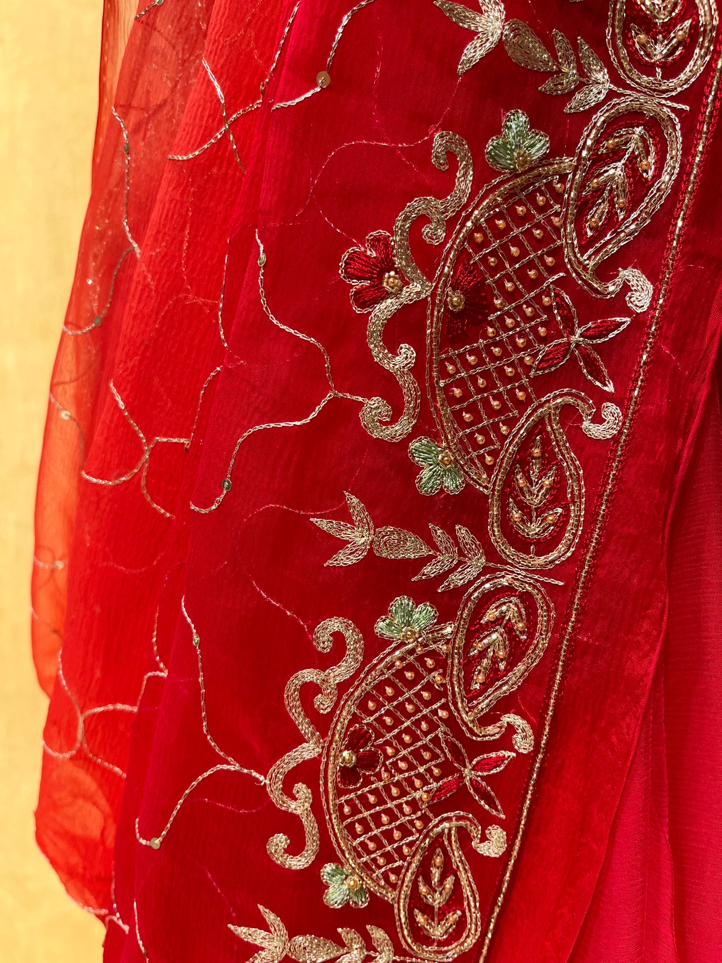 ( DELIVERY IN 20-25 DAYS ) RED SHADED PURE CHIFFON HAND EMBROIDERED SAREE EMBELLISHED WITH AARI & CUTDANA WORK