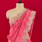 (DELIVERY IN 15-20 DAYS ) PINK COLOUR CREPE TISSUE SCALLOPED BORDER SAREE EMBELLISHED WITH CUTDANA, SEQUINS & ZARDOZI WORK