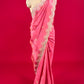 (DELIVERY IN 15-20 DAYS ) PINK COLOUR CREPE TISSUE SCALLOPED BORDER SAREE EMBELLISHED WITH CUTDANA, SEQUINS & ZARDOZI WORK