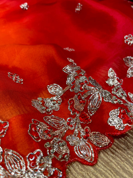 [DELIVERY IN 25-30 DAYS] RED & ORANGE SHADED ORGANZA HANDMADE SAREE EMBELLISHED WITH SILVER BADLA EMBROIDERY