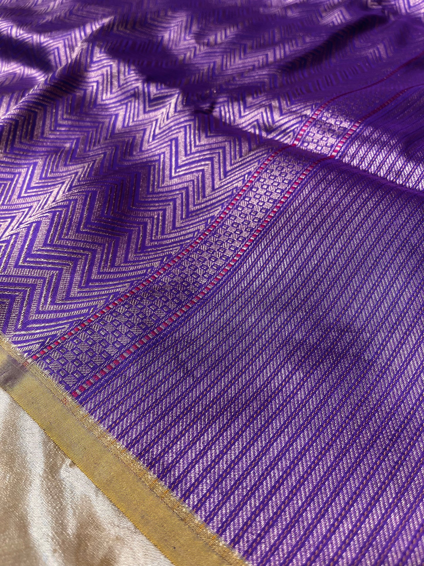 PURPLE COLOUR PURE BANARASI SILK ZIG-ZAG PATTERN SAREE EMBELLISHED WITH ZARI WEAVES