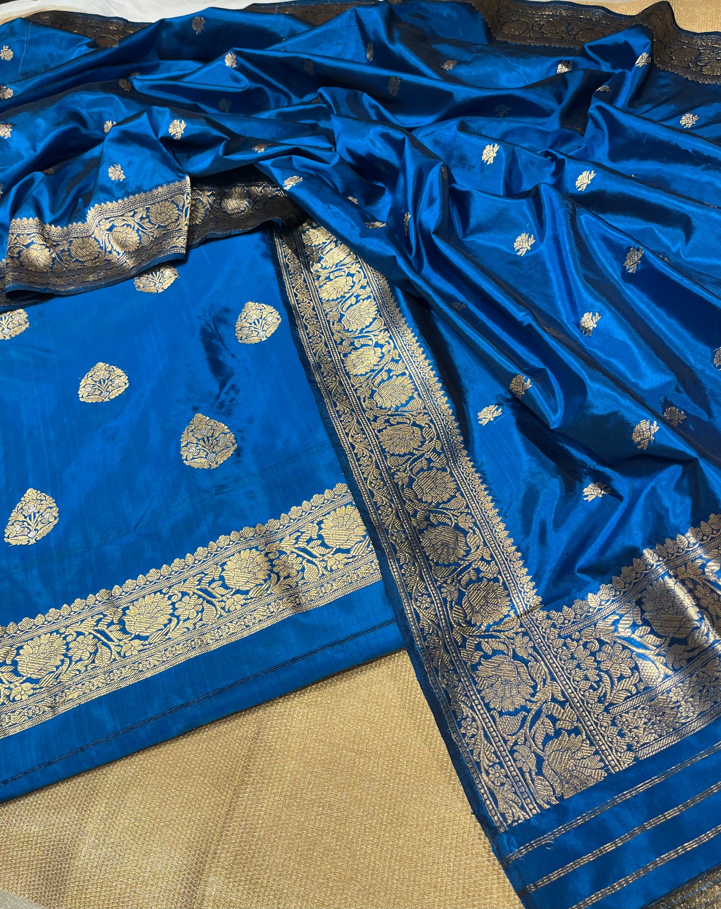 PEACOCK BLUE COLOUR PURE SILK UNSTITCHED SUIT EMBELLISHED WITH ZARI WEAVES