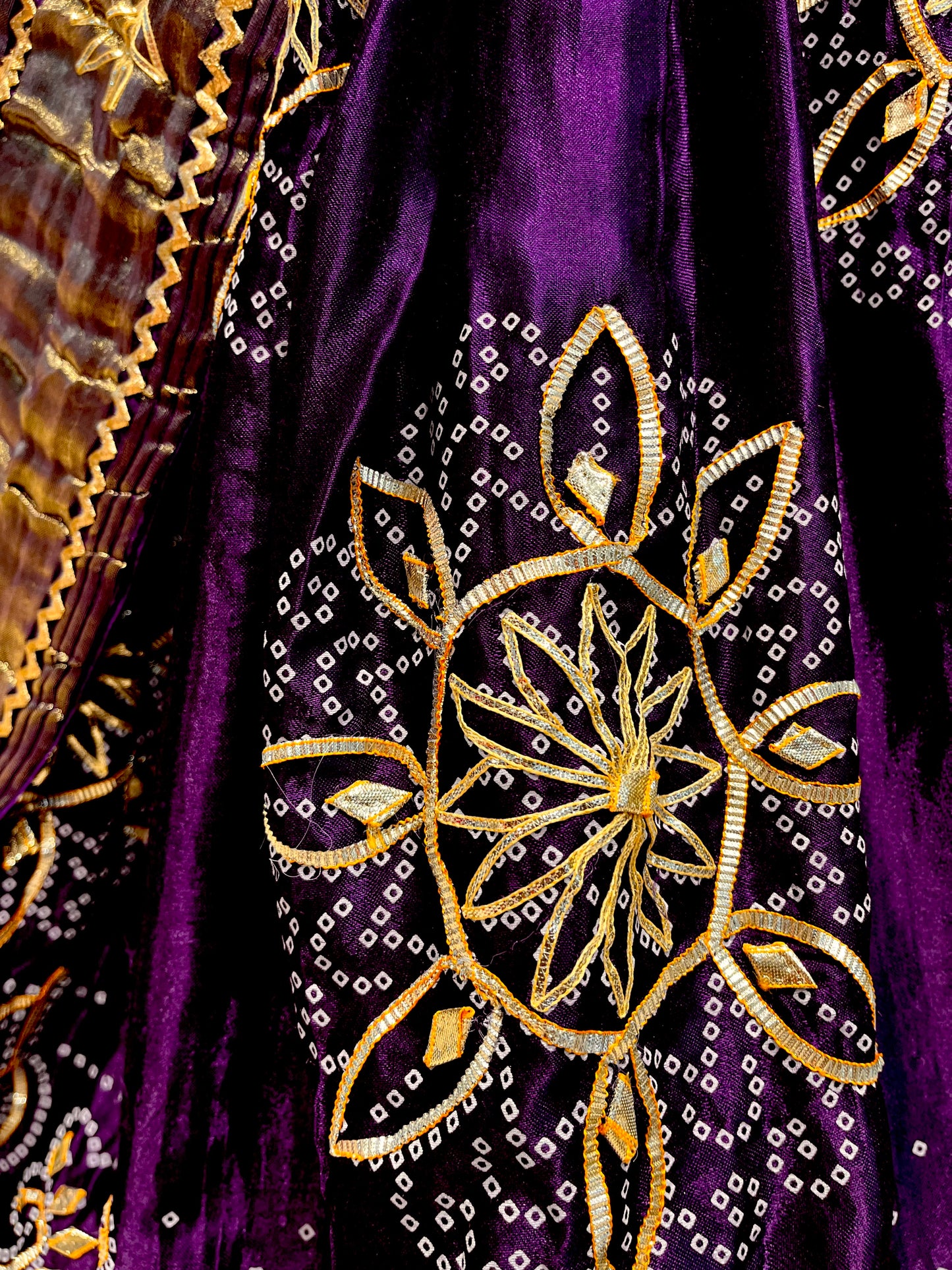 PURPLE COLOUR GAJJI SILK BANDHANI LEHENGA WITH UNSTITCHED BLOUSE EMBELLISHED WITH GOTA PATTI WORK - Kothari Sons