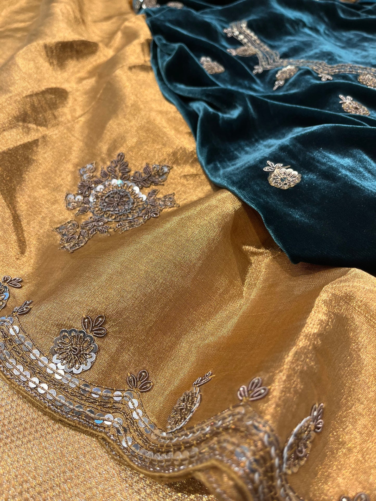 GOLDEN SILVER CHANDERI TISSUE ANTIQUE ZARI EMBROIDERED SAREE WITH TEAL BLUE COLOR VELVET BLOUSE