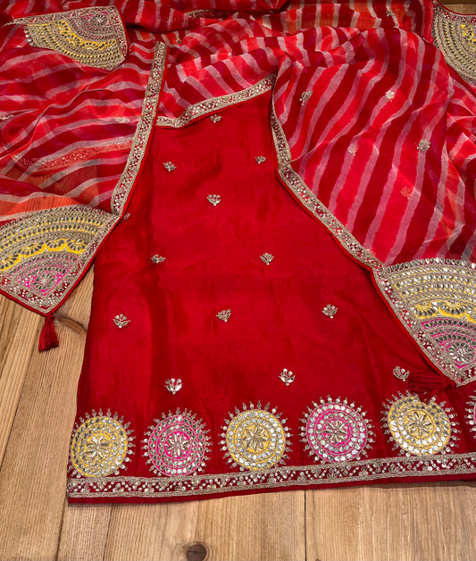 RED COLOUR PURE ORGANZA HAND EMBROIDERED UNSTITCHED SUIT WITH LEHARIYA DUPATTA EMBELLISHED WITH GOTA PATTI WORK