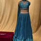 SKY BLUE COLOR CHINON LEHENGA WITH CROP TOP BLOUSE EMBELLISHED WITH ZARI WORK