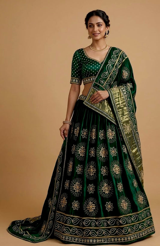 BOTTLE GREEN COLOUR GAJJI SILK BANDHANI LEHENGA WITH UNSTITCHED BLOUSE EMBELLISHED WITH GOTA PATTI WORK