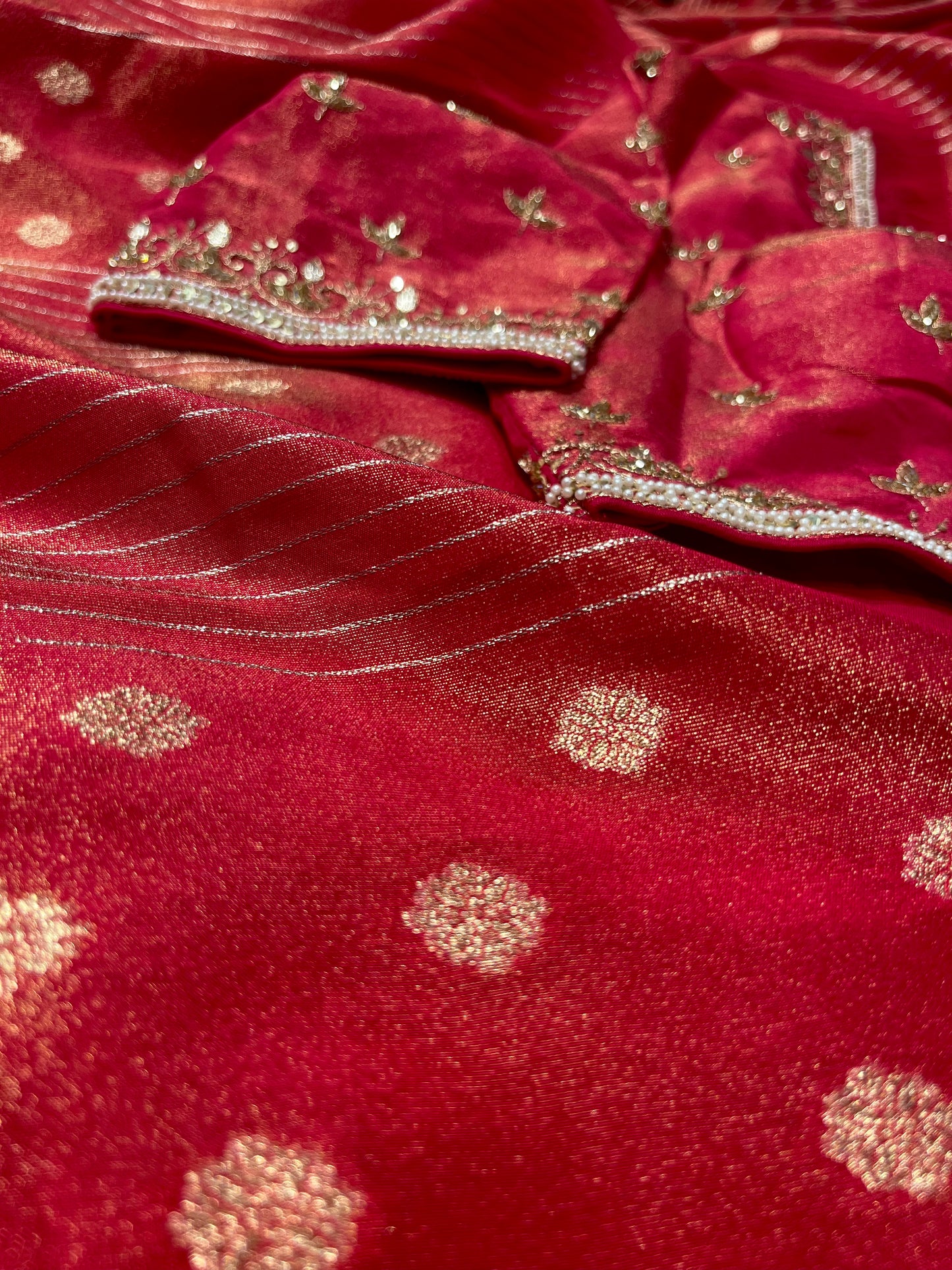 RED DOLA TISSUE SILK SAREE WITH PEARL & CUTDANA EMBELLISHED READYMADE BLOUSE