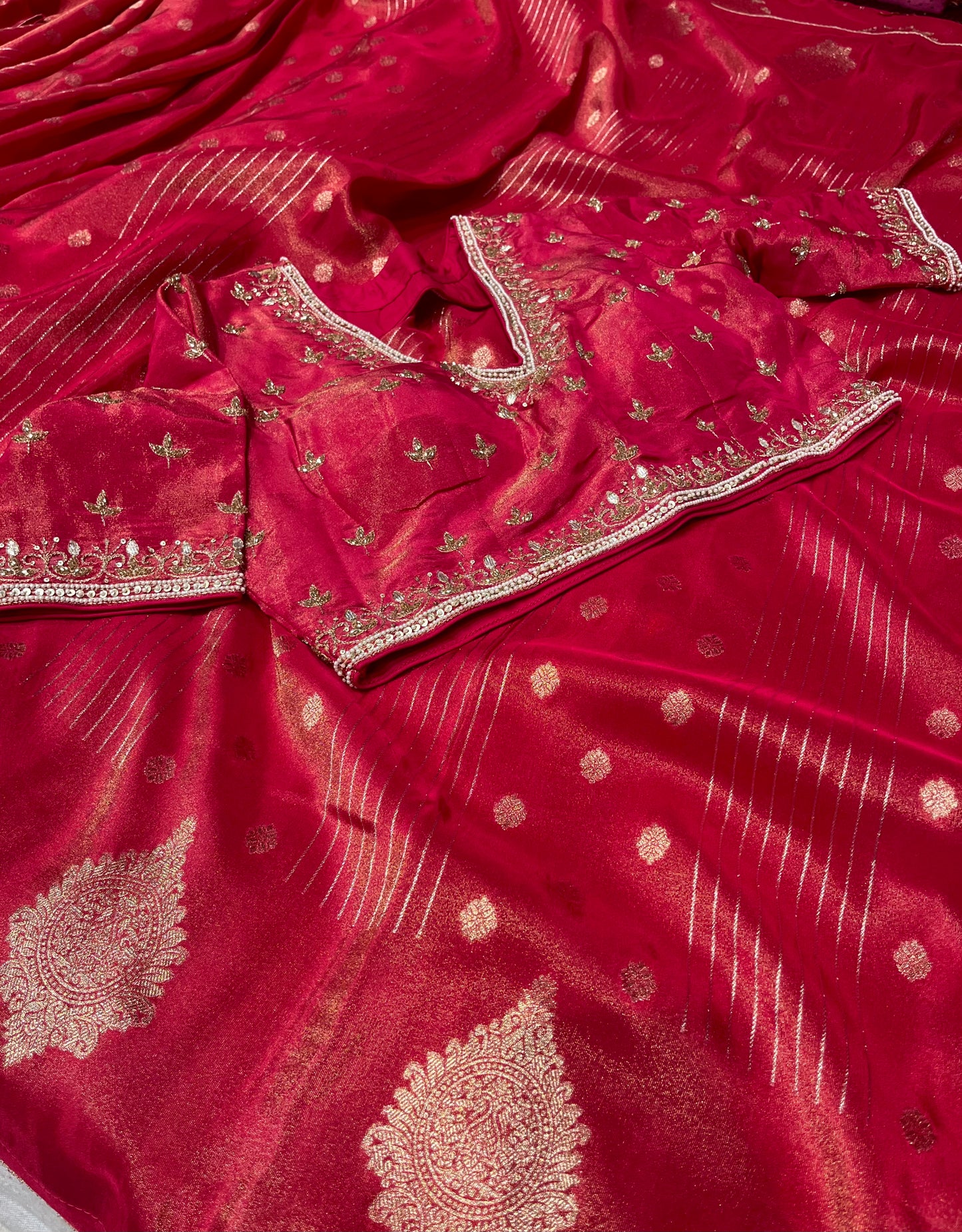 RED DOLA TISSUE SILK SAREE WITH PEARL & CUTDANA EMBELLISHED READYMADE BLOUSE