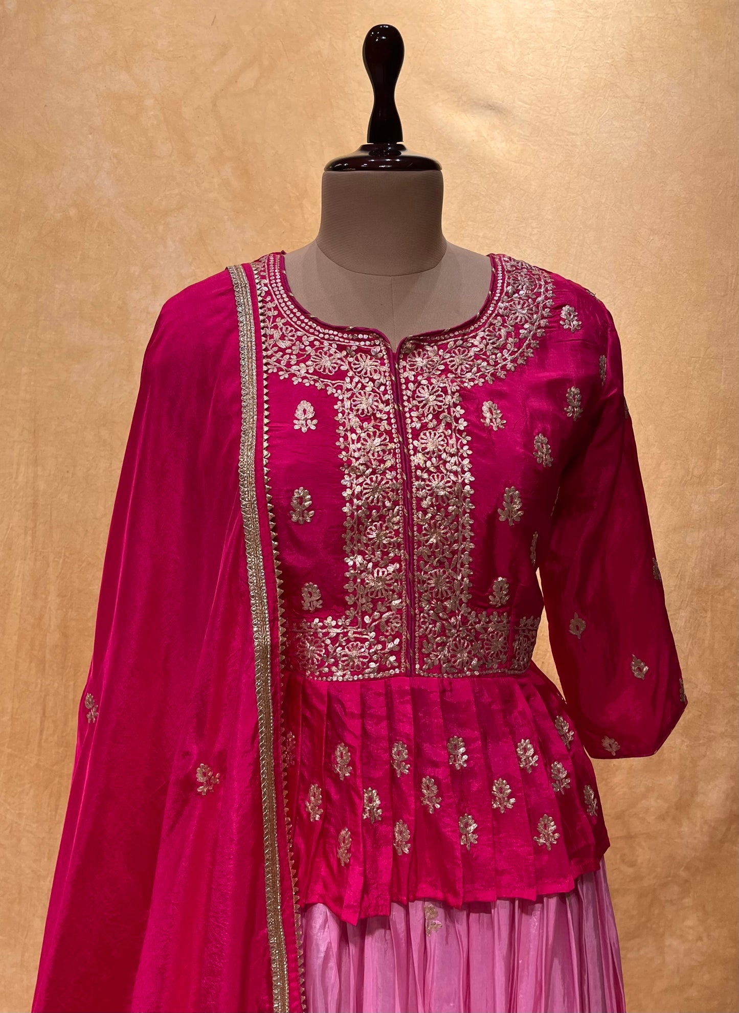 RANI COLOUR CREPE SILK SKIRT WITH PEPLUM EMBROIDERED BLOUSE EMBELLISHED WITH ZARI WORK