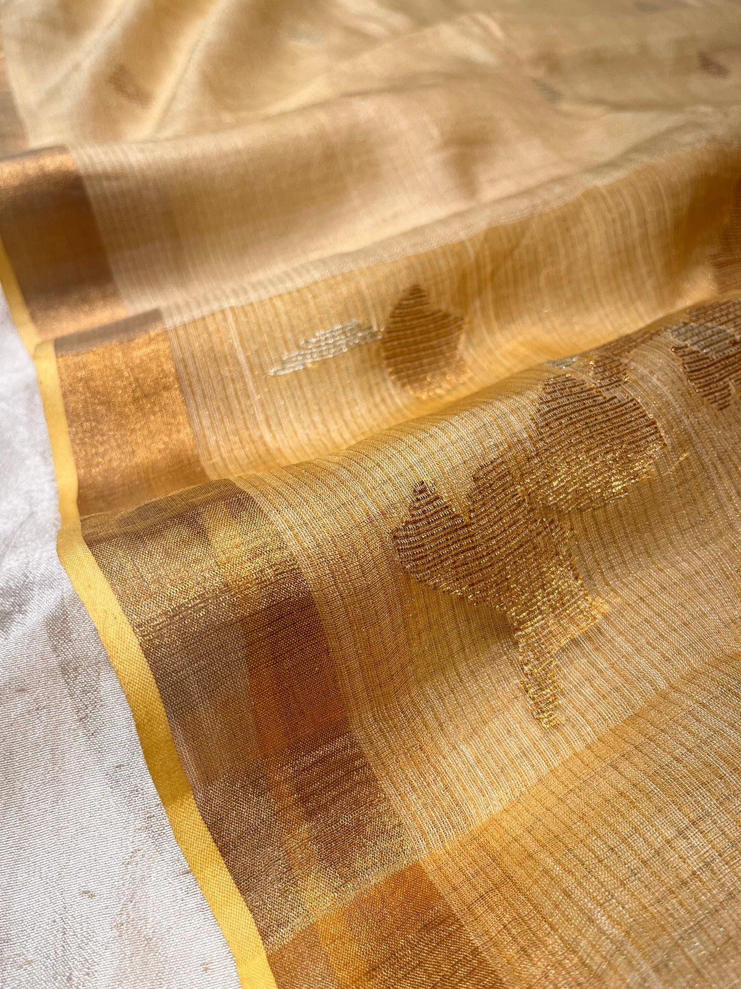 PASTEL YELLOW COLOUR MUNGA TISSUE SAREE WITH ZARI BORDER