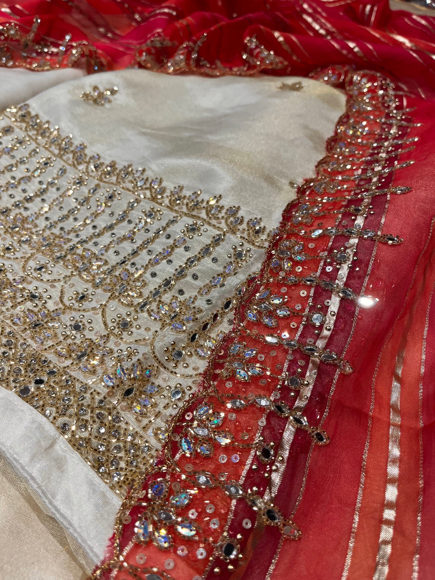 IVORY COLOUR CREPE TISSUE UNSTITCHED SUIT WOTH ORGANZA DUPATTA DMBELLISHED WITH CUTDANA WORK