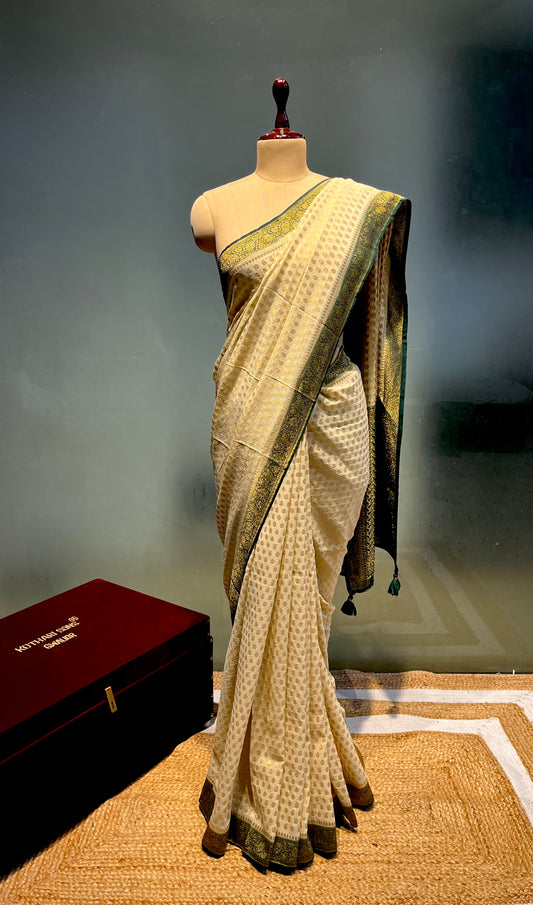 IVORY COLOUR GEORGETTE KHADDI SAREE WITH CONTRAST BORDER EMBELLIWITH ZARI WEAVES