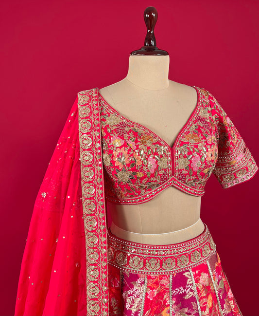 ( DELIVERY IN 15-20 DAYS ) HOT PINK & PURPLE COLOUR SILK LEHENGA WITH EMBROIDERED BLOUSE & ORGANZA DUPATTA EMBELLISHED WITH SEQUINS & ZARI WORK