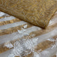 IVORY COLOUR CHANDERI GOLDEN STRIPED PARSI EMBROIDERED SAREE PAIRED WITH AN UNSTITCHED GOLDEN BLOUSE BY SIDDHAIKA - Kothari Sons