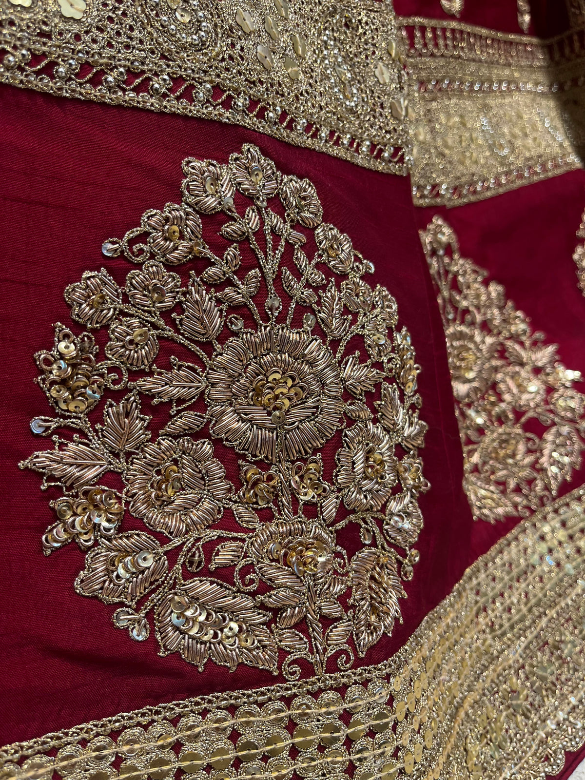 MAROON COLOUR RAW SILK BRIDAL HAND EMBROIDERED LEGENGA WITH READYMADE BLOUSE & NET DUPATTA EMBELLISHED WITH AARI, ZARDOZI & SEQUINS WORK