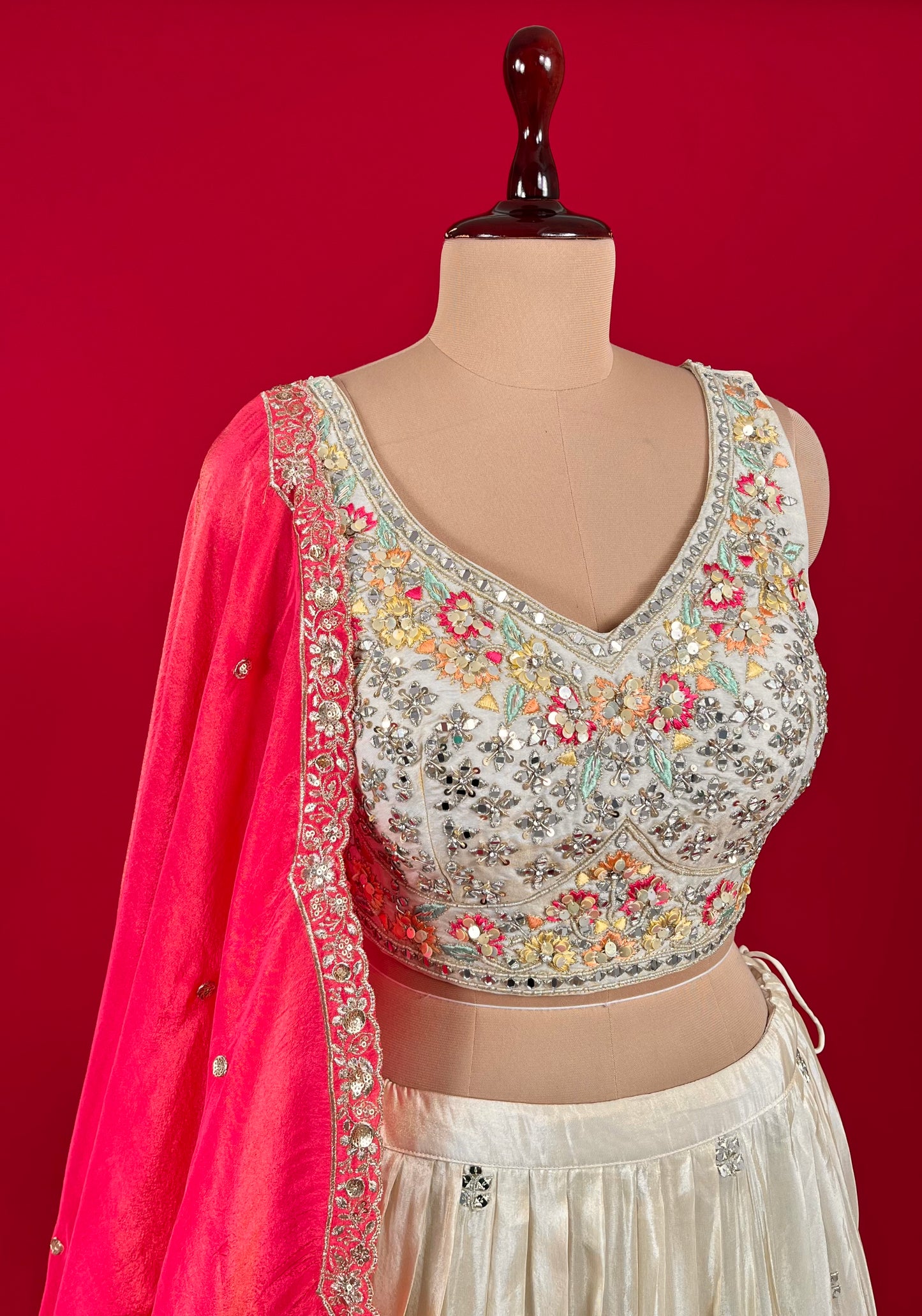 OFF WHITE COLOUR CREPE TISSUE LEHENGA WITH READYMADE BLOUSE & CONTRAST DUPATTA EMBELLISHED WITH MIRROR WORK