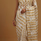 IVORY COLOUR CHANDERI GOLDEN STRIPED PARSI EMBROIDERED SAREE PAIRED WITH AN UNSTITCHED GOLDEN BLOUSE BY SIDDHAIKA - Kothari Sons