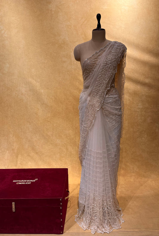 ( DELIVERY IN 25 DAYS ) Weddig Special: OFF WHITE COLOR NET HAND EMBROIDERED SAREE EMBELLISHED WITH CUTDANA & SEQUINS WORK