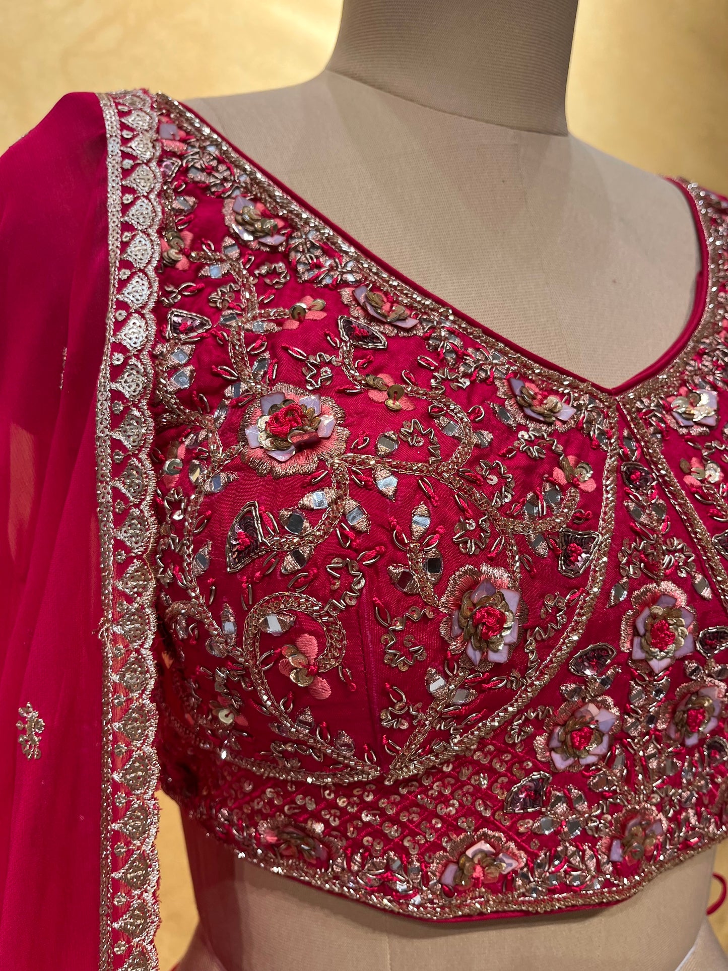 DARK PINK COLOR GEORGETTE EMBROIDERED LEHENGA WITH CROP TOP BLOUSE EMBELLISHED WITH MIRROR & ZARI WORK