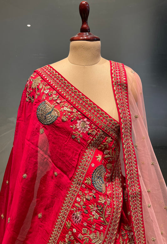 ( DELIVERY IN 25 DAYS ) RED COLOUR RAW SILK BRIDAL LEHENGA WITH NET & ORGANZA DUPATTA EMBELLISHED WITH RESHAM, ZARI & SEQUINS WORK