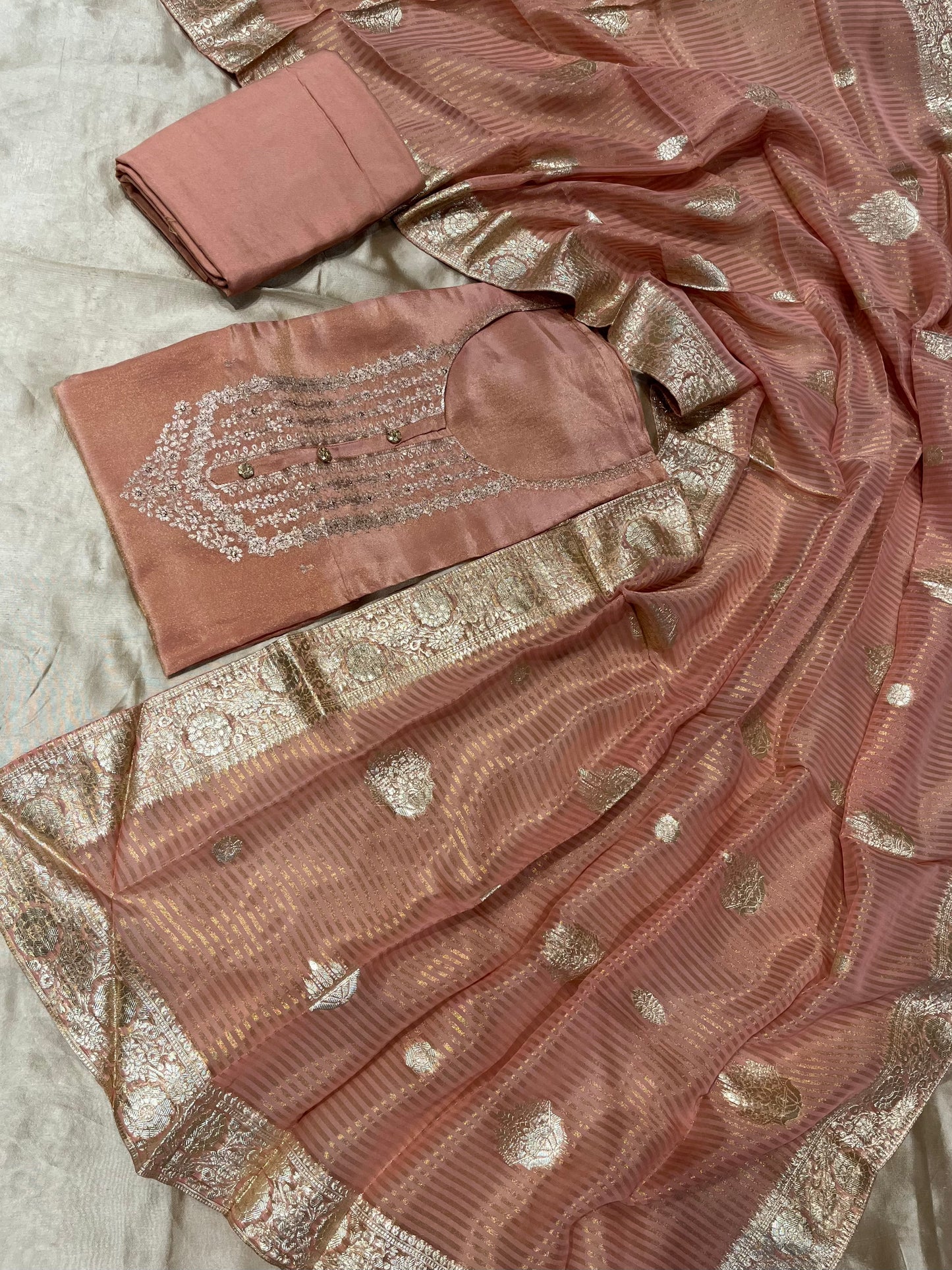 PEACH COLOUR CREPE TISSUE UNSTITCHED SUIT WITH ORGANZA DUPATTA EMBELLISHED WITH KASAB EMBROIDERY