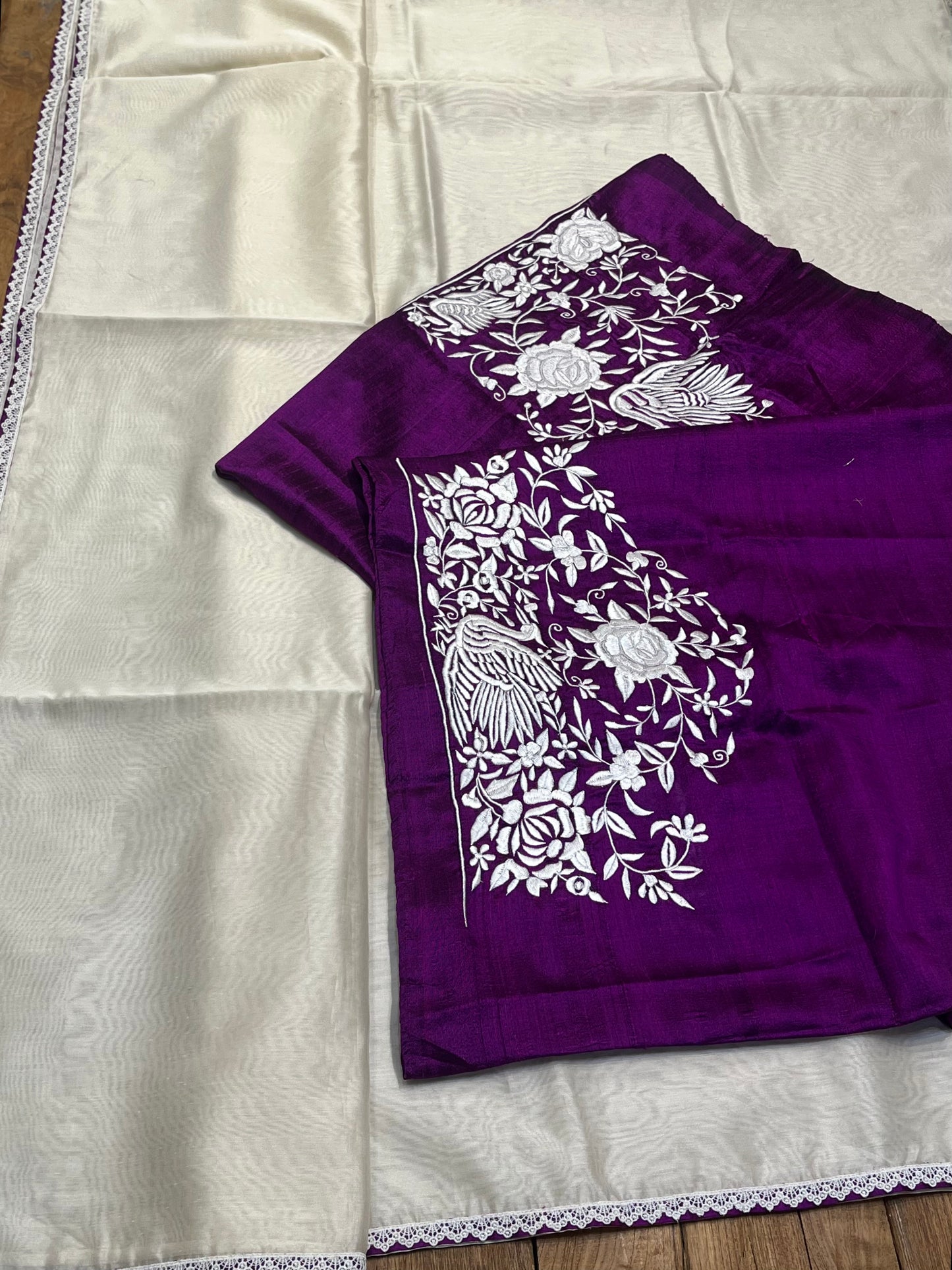 WHITE COLOUR CHANDERI SAREE WITH RAW SILK UNSTITCHED PARSI EMBROIDERED BLOUSE BY SIDDHAIKA - Kothari Sons
