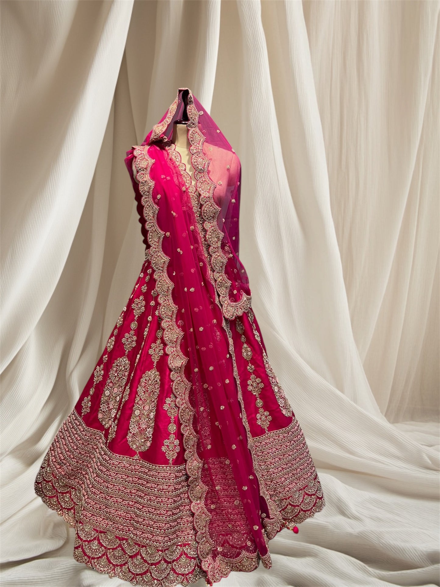 Magenta Colour  Silk lehenga with net dupatta embellished with beads , pips and zari Embroidered Bridal Lehenga