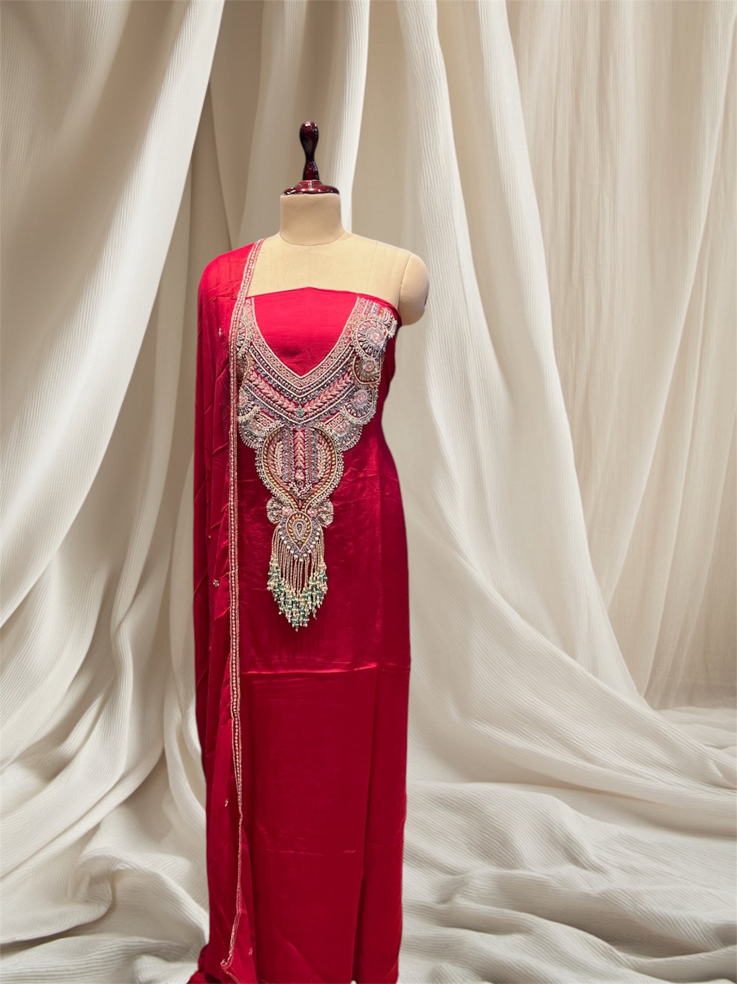 Red colour  satin silk unstitched suit  with zardozi  / pearl / sequines / resham / embroidery and emerald tassels