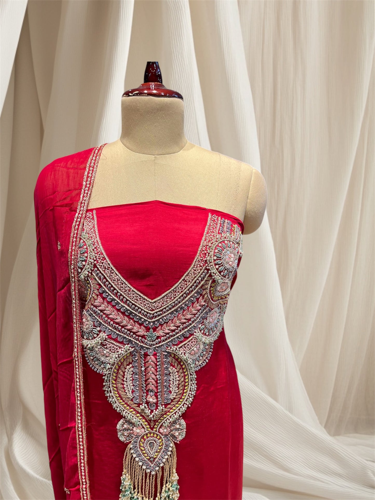 Red colour  satin silk unstitched suit  with zardozi  / pearl / sequines / resham / embroidery and emerald tassels