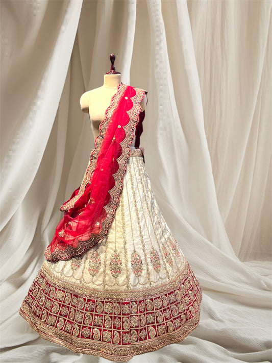 Ivory colour silk brocade lehenga embellished with beads and zari work one net and one brocade dupatta